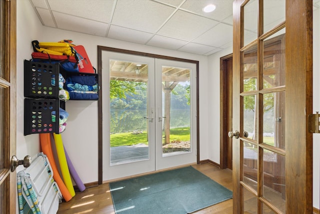 6860 Ashley Ave NE, Belding, MI 48809 - doorway to outside with french doors, wood finished floors, and a paneled ceiling