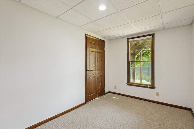 6860 Ashley Ave NE, Belding, MI 48809 - carpeted empty room with baseboards and a paneled ceiling