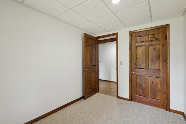 6860 Ashley Ave NE, Belding, MI 48809 - unfurnished bedroom with carpet and a drop ceiling