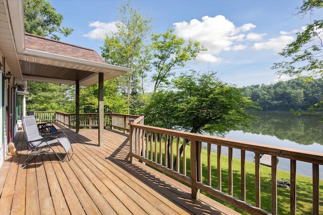 6860 Ashley Ave NE, Belding, MI 48809 - wooden terrace featuring a water view and a lawn