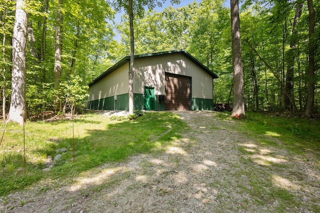 6860 Ashley Ave NE, Belding, MI 48809 - detached garage featuring driveway
