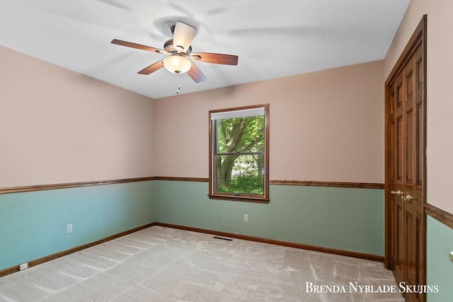 13412 Forest Park Dr, Grand Haven, MI 49417 - spare room with ceiling fan and light colored carpet