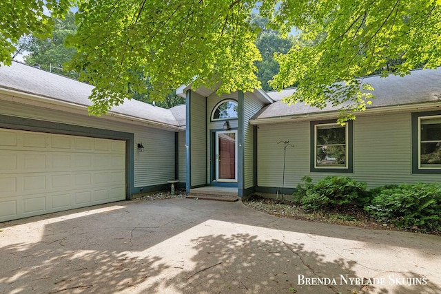 13412 Forest Park Dr, Grand Haven, MI 49417 - view of front facade with driveway and an attached garage
