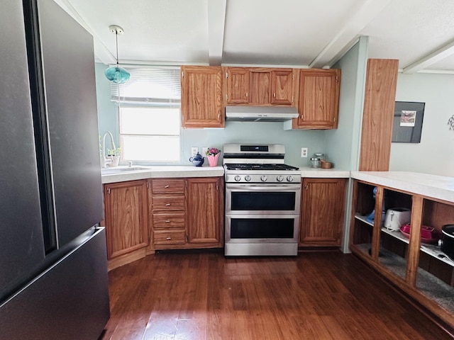 5355 Meadowmoor Dr NE, Belmont, MI 49306 - kitchen with stainless steel appliances, exhaust hood, light countertops, dark wood-type flooring, and brown cabinetry
