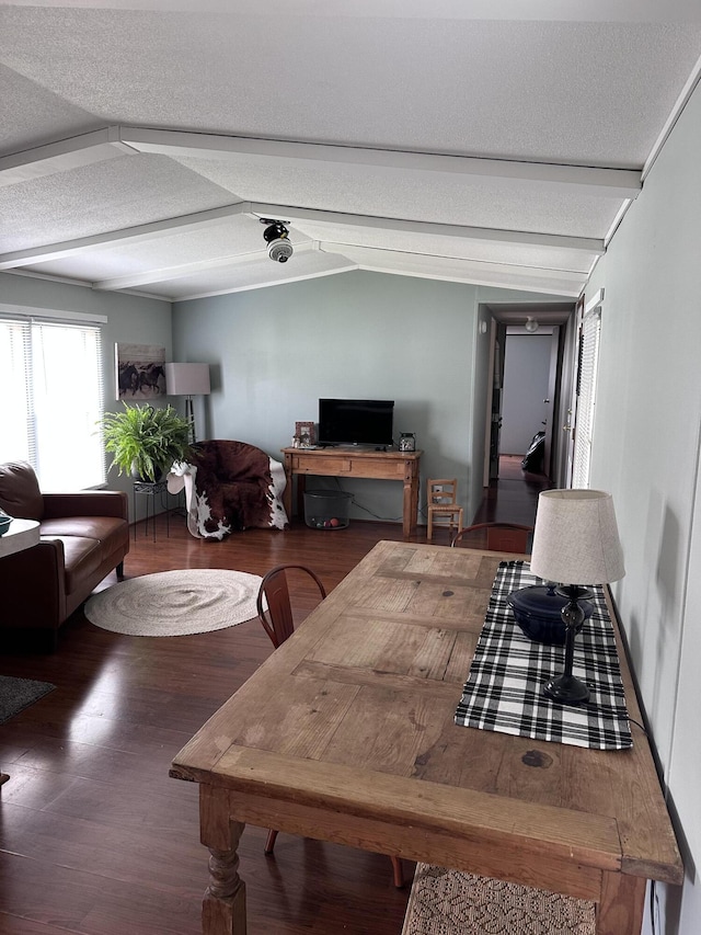 5355 Meadowmoor Dr NE, Belmont, MI 49306 - dining room with wood finished floors, vaulted ceiling, and a textured ceiling