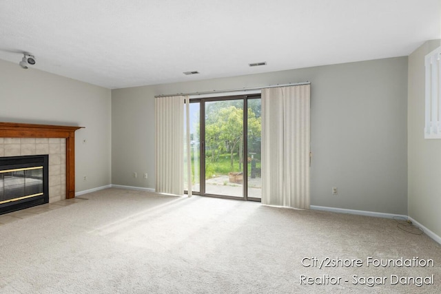 5952 Wind Brook Ave SE, Kentwood, MI 49508 - unfurnished living room with a fireplace and carpet flooring