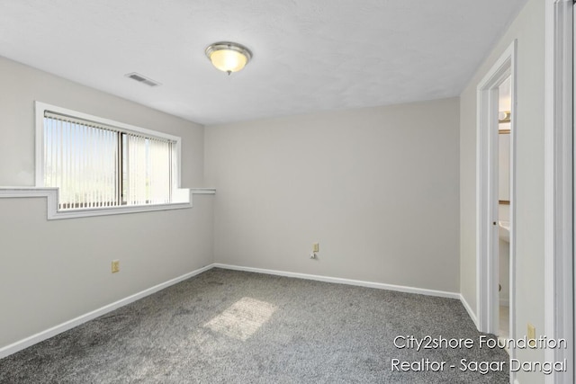 5952 Wind Brook Ave SE, Kentwood, MI 49508 - spare room featuring carpet flooring and baseboards