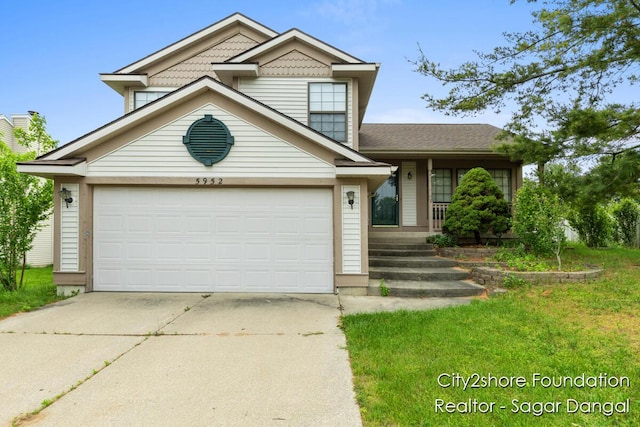5952 Wind Brook Ave SE, Kentwood, MI 49508 - view of front facade with driveway, a porch, and a front yard