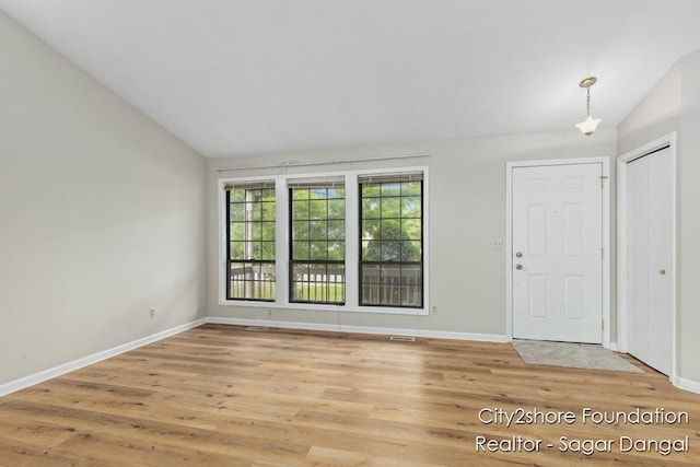 5952 Wind Brook Ave SE, Kentwood, MI 49508 - entrance foyer featuring lofted ceiling and light wood-type flooring