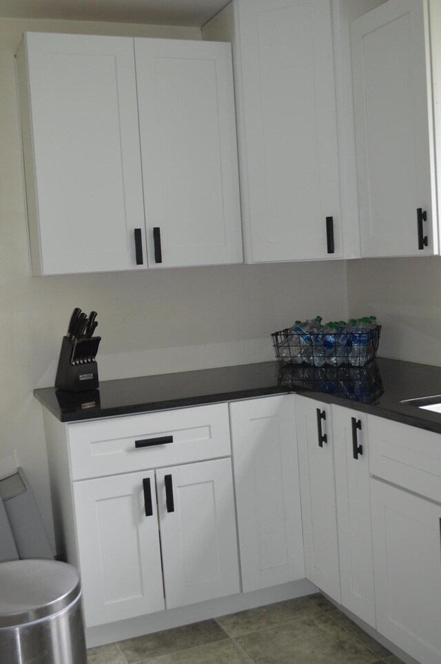 517 Winchester Ave, Saint Joseph, MI 49085 - kitchen with white cabinets and dark countertops