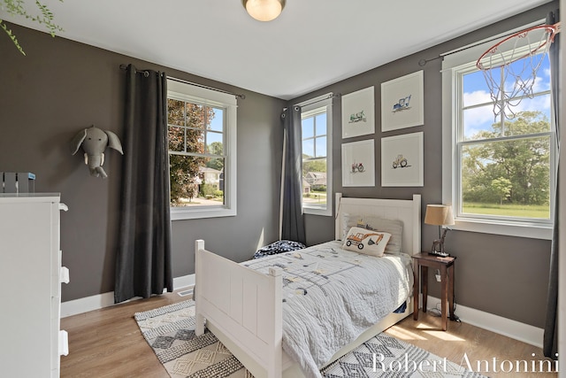 3794 Lake Birch St NE, Grand Rapids, MI 49525 - bedroom with baseboards and light wood-style flooring