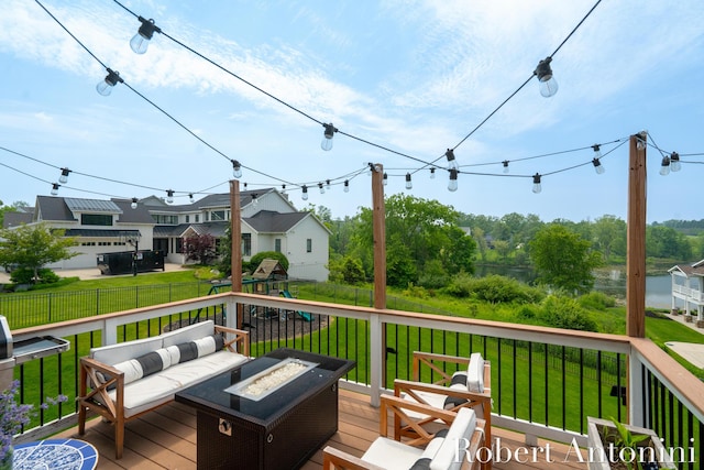 3794 Lake Birch St NE, Grand Rapids, MI 49525 - wooden deck with a playground and an outdoor living space with a fire pit
