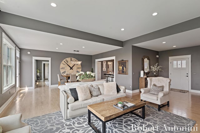 3794 Lake Birch St NE, Grand Rapids, MI 49525 - living area with light wood-style flooring, recessed lighting, and arched walkways