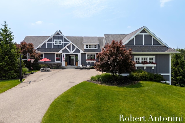 3794 Lake Birch St NE, Grand Rapids, MI 49525 - view of front of home featuring board and batten siding and a front yard