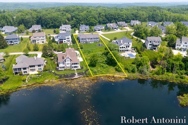 3794 Lake Birch St NE, Grand Rapids, MI 49525 - aerial perspective of suburban area with property parcel outlined and a nearby body of water