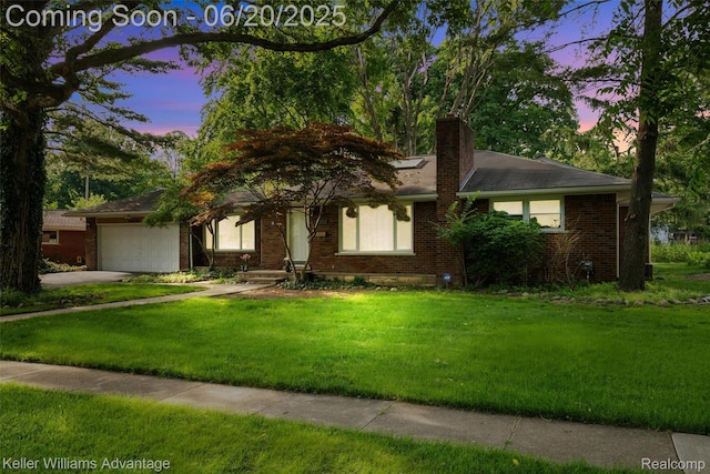 34030 Hampshire St, Livonia, MI 48154 - view of front of property featuring brick siding and a front lawn