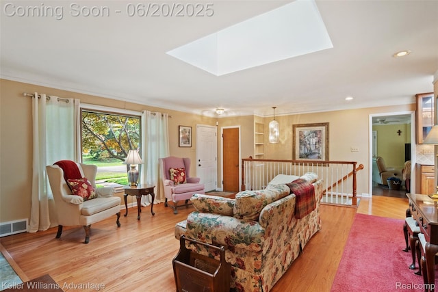 34030 Hampshire St, Livonia, MI 48154 - living area featuring light wood-style floors, a skylight, and recessed lighting
