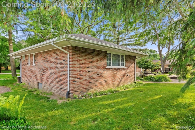 34030 Hampshire St, Livonia, MI 48154 - view of home's exterior featuring a lawn and brick siding