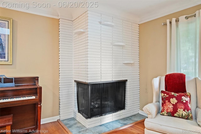 34030 Hampshire St, Livonia, MI 48154 - living area with wood finished floors, a fireplace, and ornamental molding