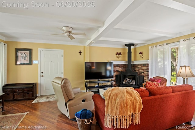 34030 Hampshire St, Livonia, MI 48154 - living area with beam ceiling, wood finished floors, a wood stove, ceiling fan, and coffered ceiling