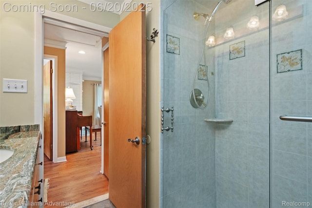 34030 Hampshire St, Livonia, MI 48154 - bathroom featuring vanity, a tile shower, and wood finished floors