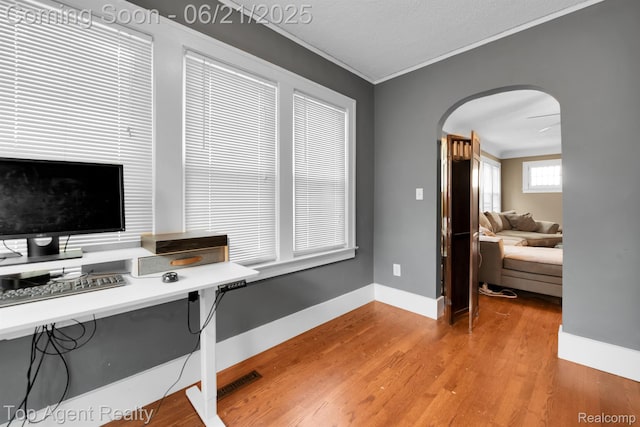 136 Alice Ave, Bloomfield Hills, MI 48302 - office area featuring arched walkways, ornamental molding, and light wood finished floors