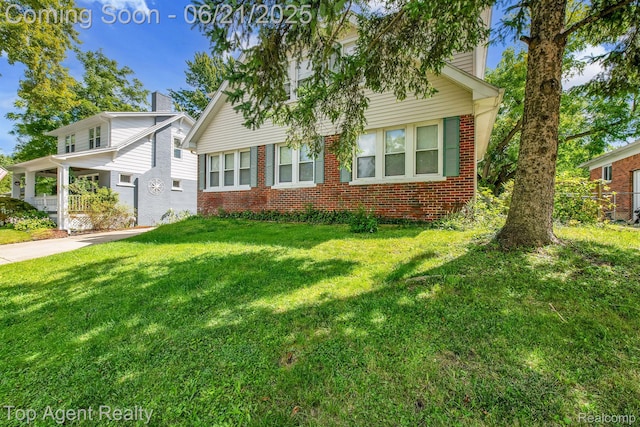 136 Alice Ave, Bloomfield Hills, MI 48302 - view of front of house featuring brick siding, a front lawn, and a chimney