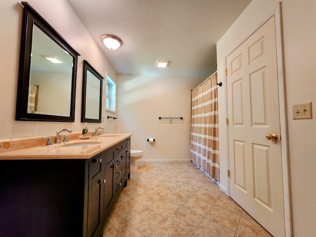 8456 Torreyhill Ct, Elmira, MI 49730 - bathroom featuring double vanity, a textured ceiling, curtained shower, and tile patterned floors