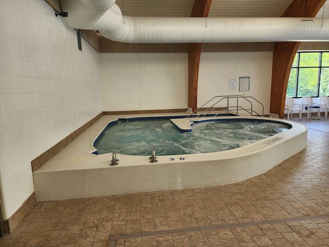 8456 Torreyhill Ct, Elmira, MI 49730 - view of pool with a hot tub