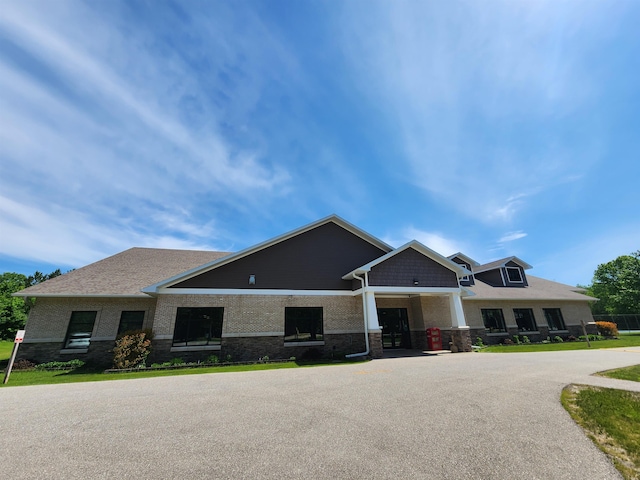 8456 Torreyhill Ct, Elmira, MI 49730 - view of front of house featuring brick siding