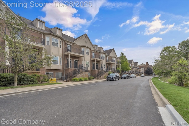 41606 Hamlet Ln, Novi, MI 48375 - view of asphalt road featuring a residential view, curbs, and sidewalks