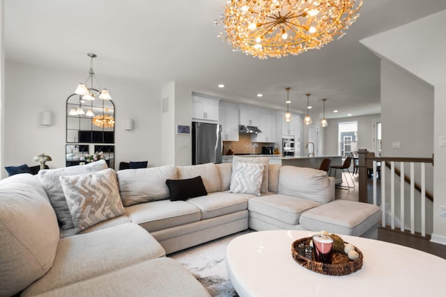 2949 Aughton Rd, Ann Arbor, MI 48105 - living area featuring a chandelier, recessed lighting, and wood finished floors
