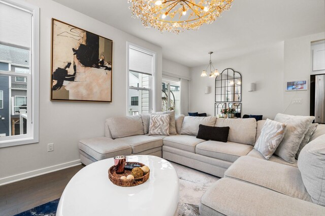 2949 Aughton Rd, Ann Arbor, MI 48105 - living room featuring a chandelier and dark wood-style flooring