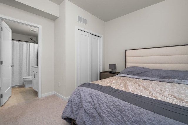 2949 Aughton Rd, Ann Arbor, MI 48105 - bedroom featuring light carpet, a closet, and ensuite bath