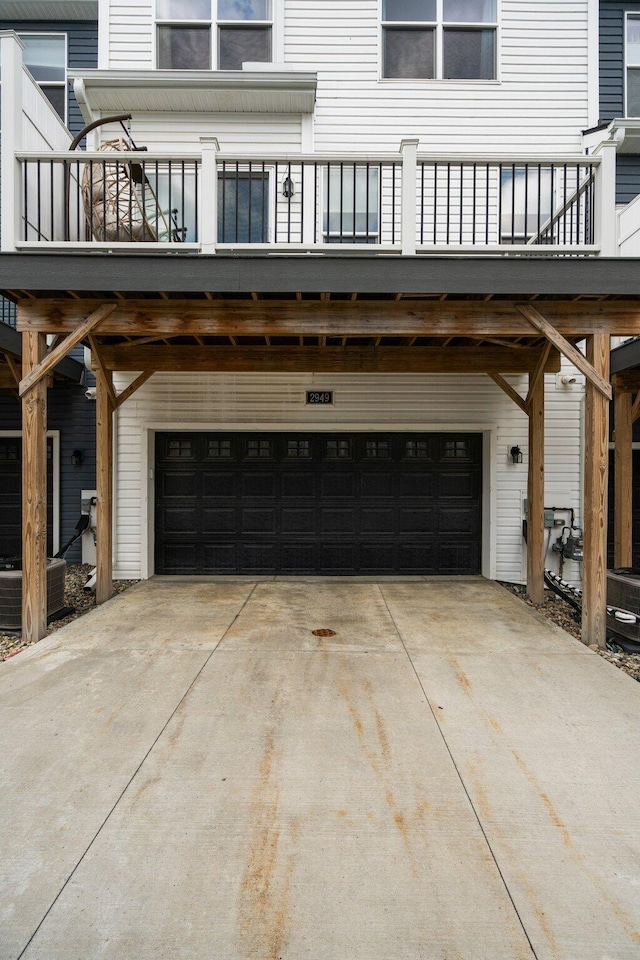 2949 Aughton Rd, Ann Arbor, MI 48105 - view of home's exterior featuring an attached garage and concrete driveway