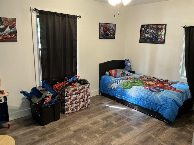 2383 Holton Rd, Muskegon, MI 49445 - bedroom featuring wood finished floors and baseboards