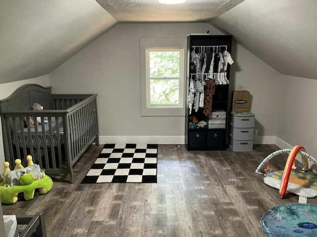 2383 Holton Rd, Muskegon, MI 49445 - bedroom with wood finished floors and vaulted ceiling