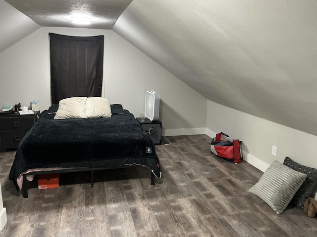 2383 Holton Rd, Muskegon, MI 49445 - bedroom with lofted ceiling and wood finished floors
