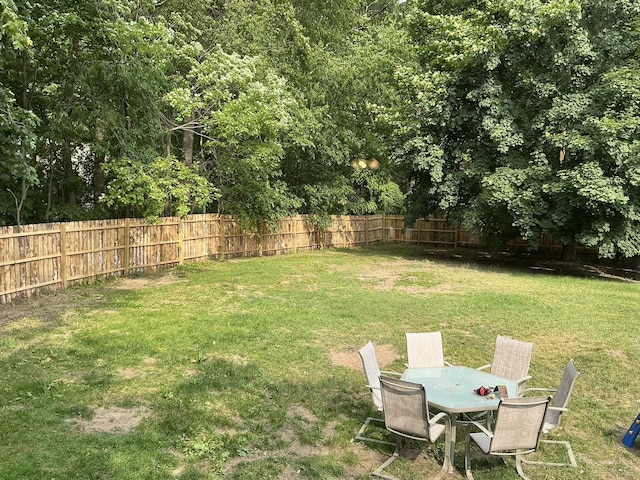 2383 Holton Rd, Muskegon, MI 49445 - fenced yard featuring outdoor dining area