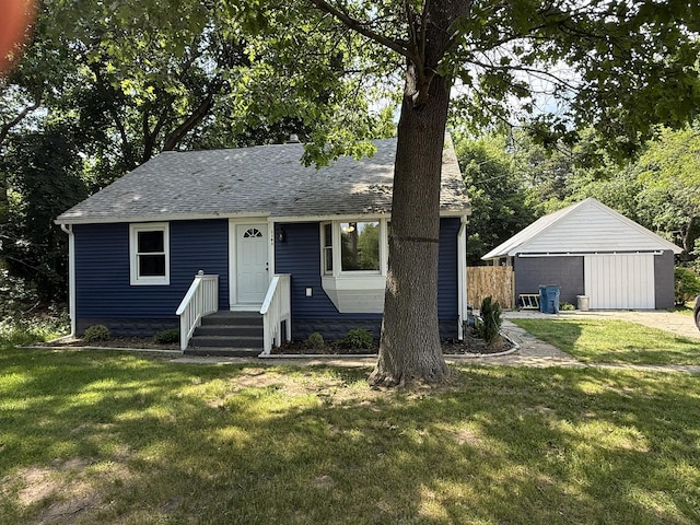 2383 Holton Rd, Muskegon, MI 49445 - view of front of home featuring a front lawn and a shingled roof