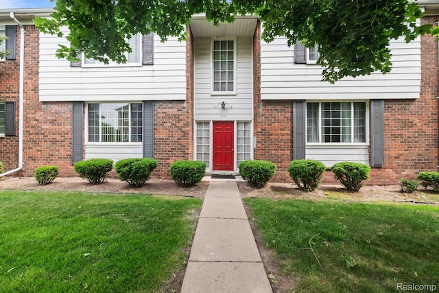 25316 Shiawassee Cir Unit 103, Southfield, MI 48033 - townhome / multi-family property with a front lawn and brick siding