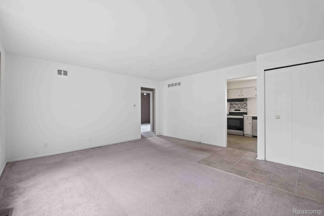 25316 Shiawassee Cir Unit 103, Southfield, MI 48033 - unfurnished living room featuring light colored carpet