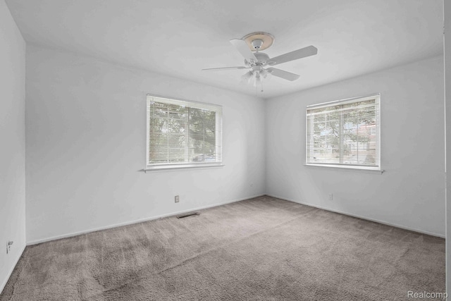 25316 Shiawassee Cir Unit 103, Southfield, MI 48033 - spare room featuring healthy amount of natural light, carpet, and a ceiling fan
