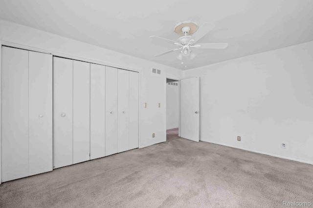 25316 Shiawassee Cir Unit 103, Southfield, MI 48033 - unfurnished bedroom featuring carpet floors, a closet, and a ceiling fan