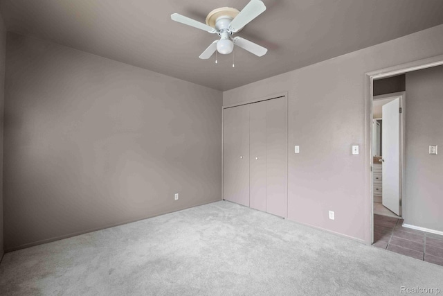 25316 Shiawassee Cir Unit 103, Southfield, MI 48033 - unfurnished bedroom featuring carpet, a closet, and ceiling fan