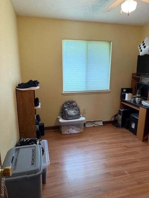 5496 Elizabeth Lake Rd, Waterford, MI 48327 - office space with wood finished floors and ceiling fan