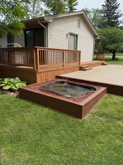 5496 Elizabeth Lake Rd, Waterford, MI 48327 - back of property featuring a wooden deck and a yard