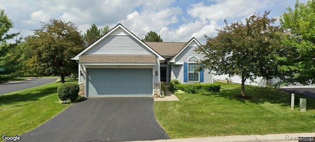 912 Rikki Anne Ct, Wixom, MI 48393 - view of front of home featuring asphalt driveway, a front lawn, and an attached garage