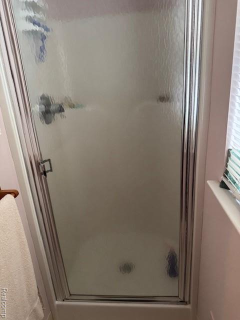 912 Rikki Anne Ct, Wixom, MI 48393 - bathroom featuring a shower stall