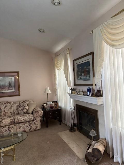 912 Rikki Anne Ct, Wixom, MI 48393 - carpeted living area featuring a tiled fireplace